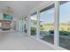 Spacious lanai with sliding glass doors and golf course views at 1558 Belfry Dr, Venice, FL 34292