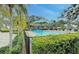Inviting community pool with surrounding greenery at 1558 Belfry Dr, Venice, FL 34292