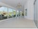 Sunroom with multiple windows overlooking the golf course at 1558 Belfry Dr, Venice, FL 34292