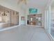 Sunroom with glass sliders and view of backyard at 1558 Belfry Dr, Venice, FL 34292