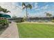 Community tennis courts with lush landscaping and walkways at 1558 Belfry Dr, Venice, FL 34292