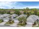 Bird's-eye view of villas with tile roofs and mature landscaping at 1647 Lancashire Dr # 1647, Venice, FL 34293