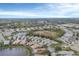 Aerial view of a residential community with a lake at 1647 Lancashire Dr # 1647, Venice, FL 34293