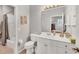 Clean bathroom with white vanity and a tub shower combo at 1647 Lancashire Dr # 1647, Venice, FL 34293