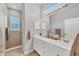 Bathroom with double vanity, shower, and separate tub at 1647 Lancashire Dr # 1647, Venice, FL 34293