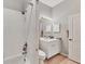 Simple bathroom with a shower/tub, toilet, and vanity at 1647 Lancashire Dr # 1647, Venice, FL 34293