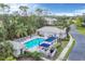 Resort-style pool with comfortable lounge chairs and shaded seating areas at 1647 Lancashire Dr # 1647, Venice, FL 34293