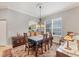 Elegant dining room with a chandelier and hardwood floors at 1647 Lancashire Dr # 1647, Venice, FL 34293