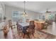 Spacious dining area with a view into the living room at 1647 Lancashire Dr # 1647, Venice, FL 34293