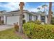 White one-story home with a two-car garage and manicured landscaping at 1647 Lancashire Dr # 1647, Venice, FL 34293