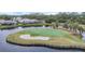 Aerial view of St Andrews East golf course island green at 1647 Lancashire Dr # 1647, Venice, FL 34293