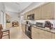 Bright kitchen featuring granite countertops and ample cabinetry at 1647 Lancashire Dr # 1647, Venice, FL 34293