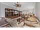 Living room with tiled floors and neutral color palette at 1647 Lancashire Dr # 1647, Venice, FL 34293