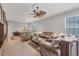 Living room with tiled floors and neutral color palette at 1647 Lancashire Dr # 1647, Venice, FL 34293