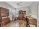 Bright home office with hardwood floors and built-in shelving at 1647 Lancashire Dr # 1647, Venice, FL 34293