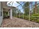 Spacious screened in patio with brick flooring at 1647 Lancashire Dr # 1647, Venice, FL 34293