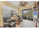 Relaxing sunroom with leather seating and access to the backyard at 1647 Lancashire Dr # 1647, Venice, FL 34293