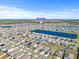 Aerial view of community amenities including a lake at 16766 Carlton Pond St, Wimauma, FL 33598