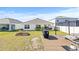 Large backyard with deck, grill, and garden space at 16766 Carlton Pond St, Wimauma, FL 33598