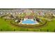 Resort-style community pool with surrounding landscaping at 16766 Carlton Pond St, Wimauma, FL 33598