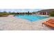 Resort-style community pool with lap lanes and plenty of lounge chairs at 16766 Carlton Pond St, Wimauma, FL 33598