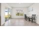 Bright dining area with table and chairs near sliding door at 16766 Carlton Pond St, Wimauma, FL 33598