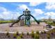Modern playground structure with slides and climbing wall at 16766 Carlton Pond St, Wimauma, FL 33598