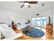 Living room with bay window, water view, and nautical rug at 17 S Port Dr, Venice, FL 34285