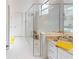 Modern bathroom with a walk-in shower and granite vanity at 2009 Mackerel St, Port Charlotte, FL 33953
