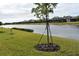 Waterfront property showcasing a peaceful canal view and lush greenery at 2009 Mackerel St, Port Charlotte, FL 33953