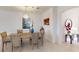 Bright dining room featuring a stylish light fixture and seating for six at 2009 Mackerel St, Port Charlotte, FL 33953