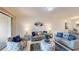 Open living room featuring neutral decor and ample natural light at 2009 Mackerel St, Port Charlotte, FL 33953