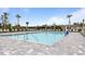 Community pool with plenty of lounge chairs at 2009 Mackerel St, Port Charlotte, FL 33953
