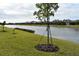 Peaceful waterfront view of a canal and lush landscaping at 2009 Mackerel St, Port Charlotte, FL 33953