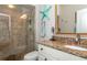 Bathroom with granite countertop and a walk-in shower at 201 Auburn Woods Cir, Venice, FL 34292