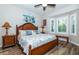 Bright bedroom with wood flooring and a king-size bed at 201 Auburn Woods Cir, Venice, FL 34292