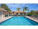 Refreshing community pool with lounge chairs at 201 Auburn Woods Cir, Venice, FL 34292
