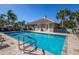 Inviting community pool with plenty of lounge chairs at 201 Auburn Woods Cir, Venice, FL 34292