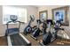 Well-equipped fitness center with treadmills and stationary bikes at 201 Auburn Woods Cir, Venice, FL 34292
