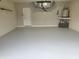 Clean and spacious garage with epoxy flooring and ample storage at 201 Auburn Woods Cir, Venice, FL 34292