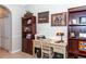 Home office with built-in shelving and a comfortable work space at 201 Auburn Woods Cir, Venice, FL 34292