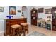 Home office features built-in shelving and a work desk at 201 Auburn Woods Cir, Venice, FL 34292