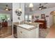 Open kitchen with island and breakfast bar at 201 Auburn Woods Cir, Venice, FL 34292