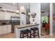 Kitchen island with granite countertop and breakfast bar at 201 Auburn Woods Cir, Venice, FL 34292
