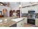 Kitchen with granite countertops and stainless steel appliances at 201 Auburn Woods Cir, Venice, FL 34292