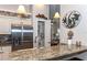 Kitchen with granite countertop and stainless steel appliances at 201 Auburn Woods Cir, Venice, FL 34292