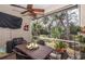 Relaxing screened porch with outdoor furniture at 201 Auburn Woods Cir, Venice, FL 34292