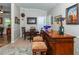 Wet bar with wood cabinetry, seating and decorative accents at 201 Auburn Woods Cir, Venice, FL 34292