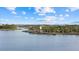 Aerial view of community lake with observation tower and walking paths at 20450 Passagio Dr, Venice, FL 34293
