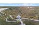 Aerial view of community lake with observation tower and walking paths at 20450 Passagio Dr, Venice, FL 34293